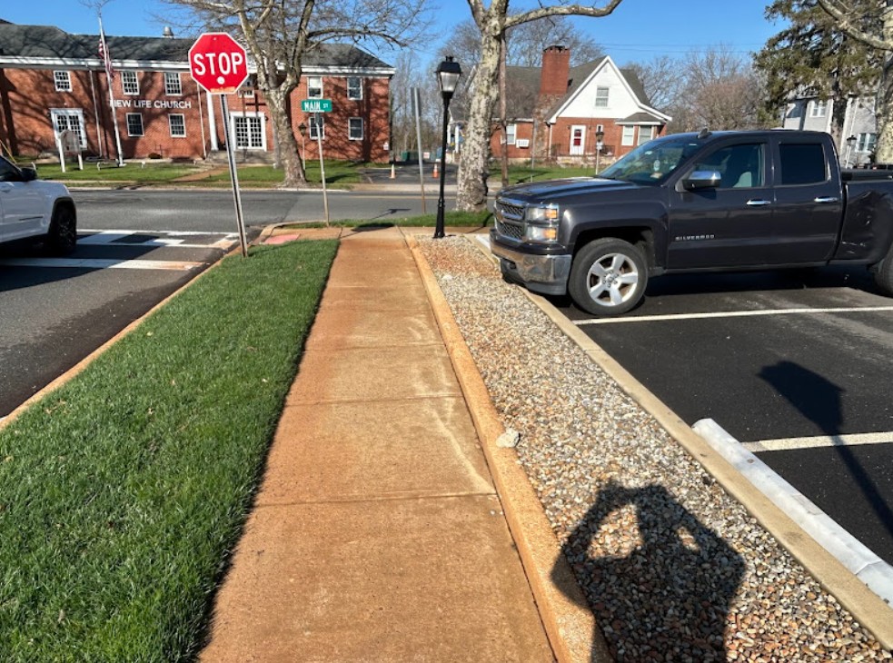 pressure washing commercial sidewalk before